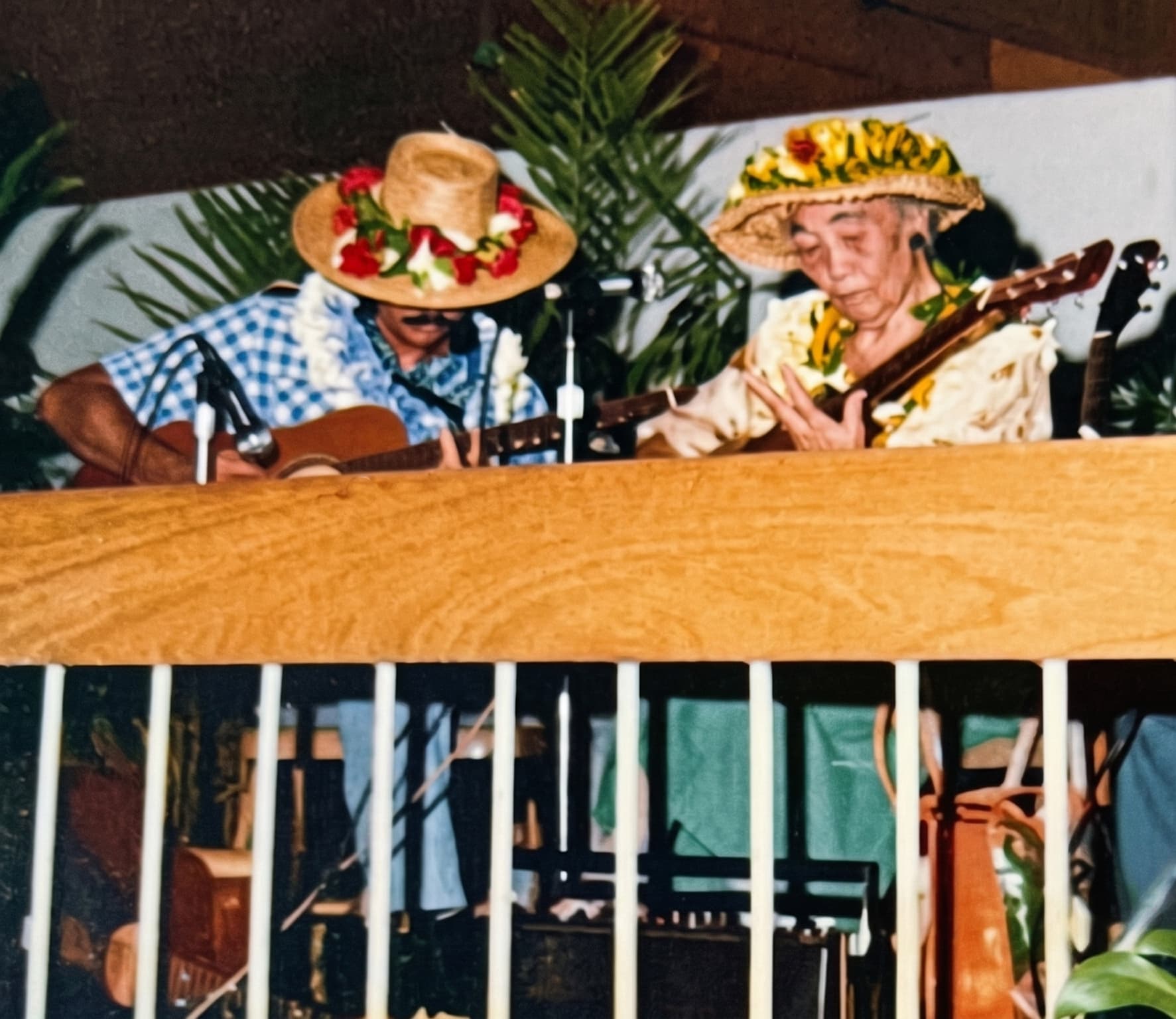 Palani Elua playing slack key guitar with Aunty Alice Nāmakelua